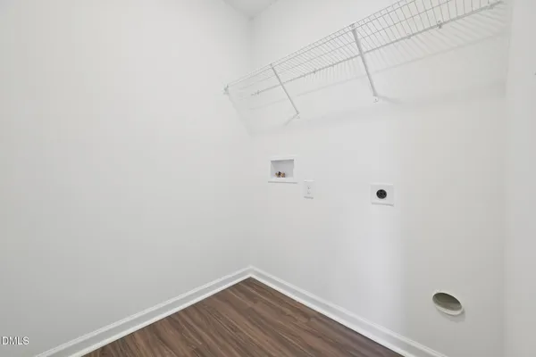 an empty room with closet area