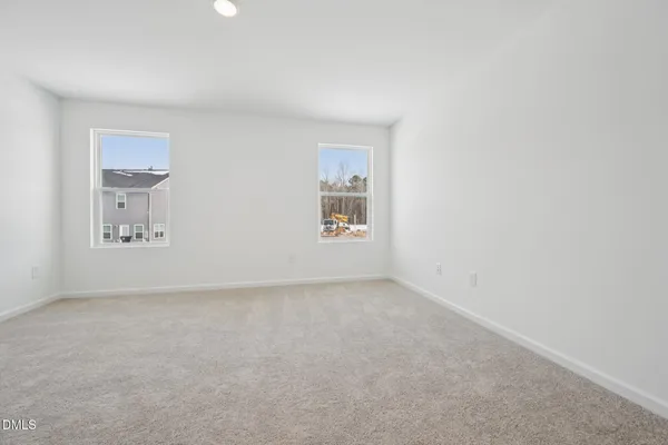 a bathroom with a glass shower door and mirror