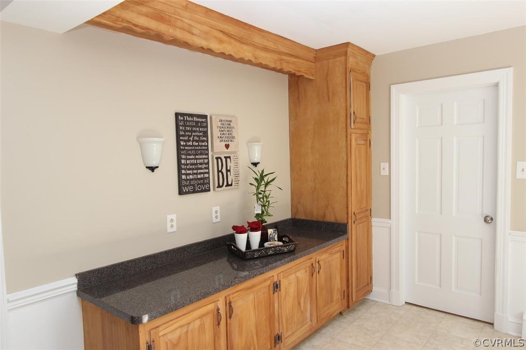 4312 Croatan Road Richmond, VA 23235 - Photo 14 of 26 a bathroom with a granite countertop sink and a mirror