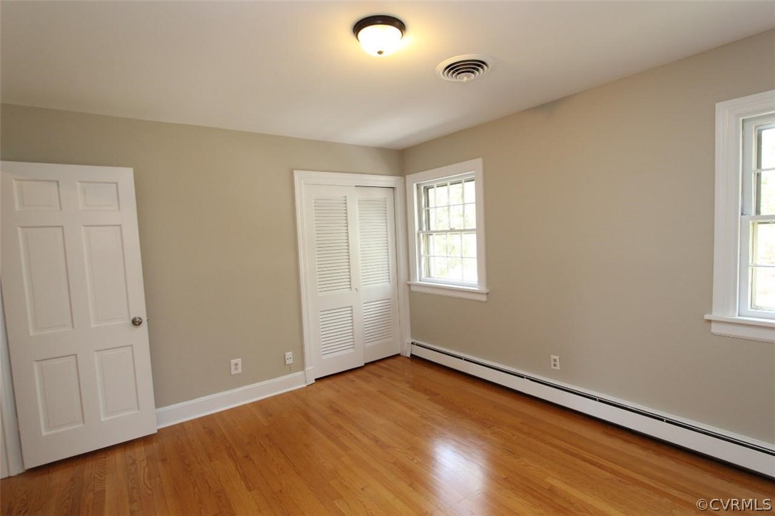 4312 Croatan Road Richmond, VA 23235 - Photo 23 of 26 wooden floor in an empty room with a window