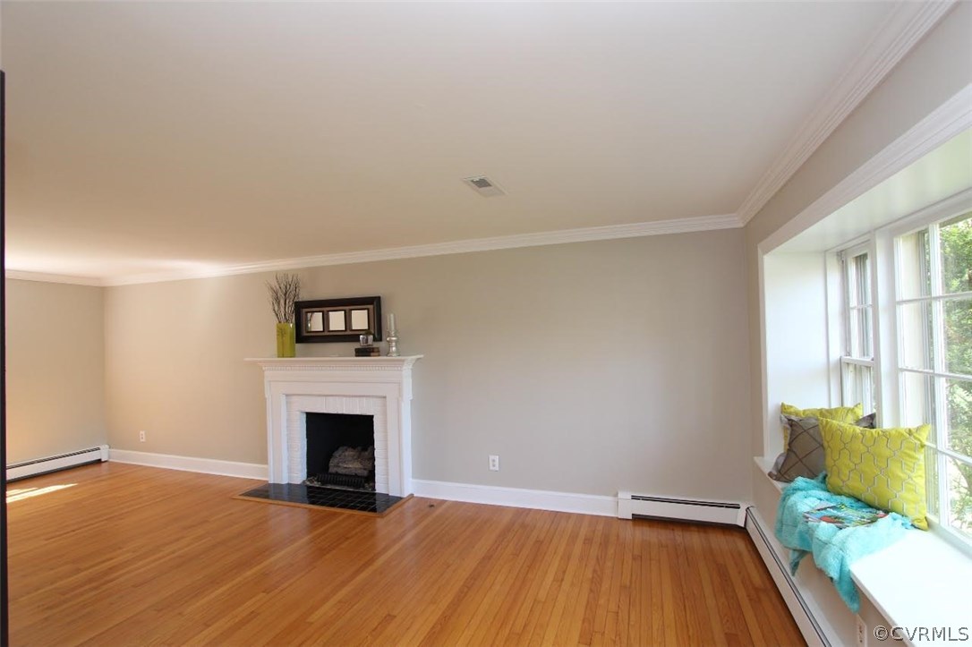 4312 Croatan Road Richmond, VA 23235 - Photo 5 of 26 wooden floor fireplace and windows in an empty room