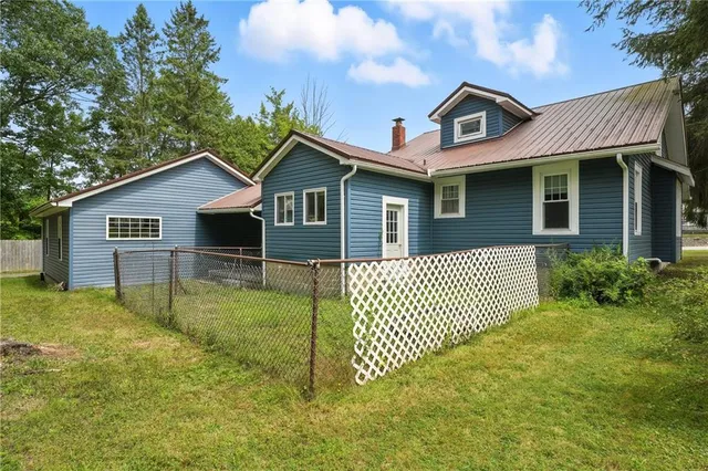 a front view of a house with a yard and porch
