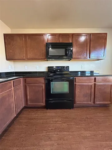 a kitchen with stainless steel appliances granite countertop a stove and a sink