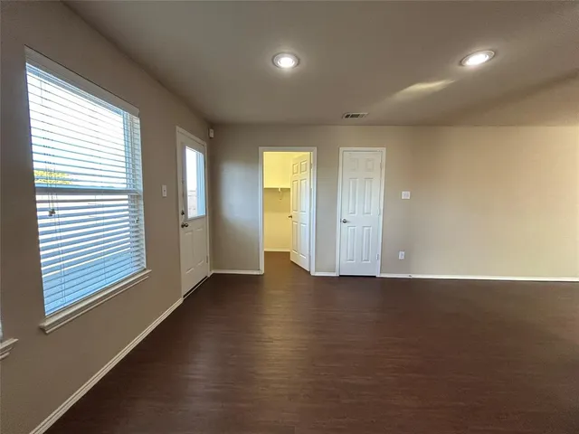 a view of an empty room with a window