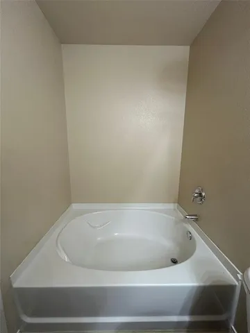 a bathroom with a double vanity sink mirror and shower
