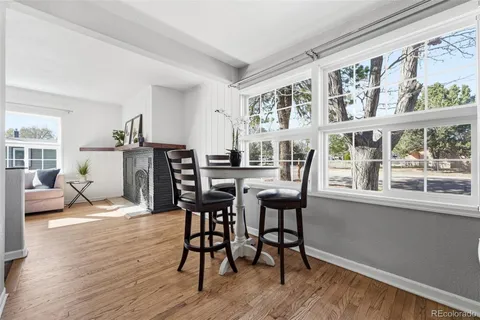 a view of a dining room with furniture window and wooden floor