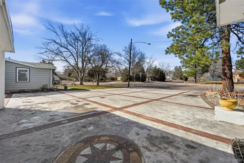a view of a playground with basketball court
