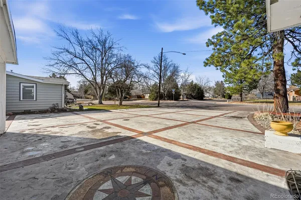 a view of a playground with basketball court