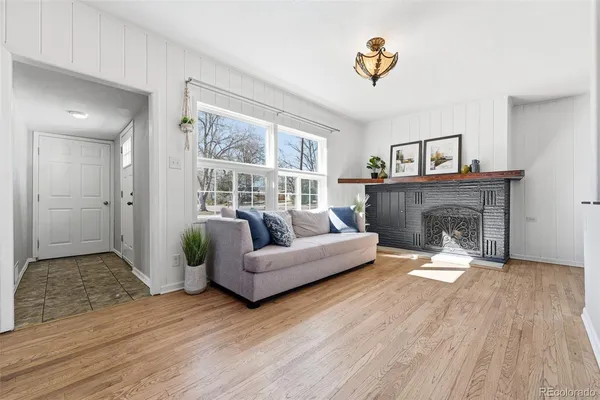 a living room with furniture and a fireplace
