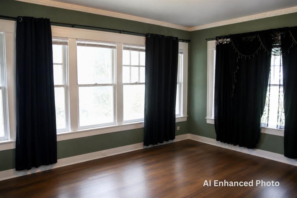 1500 Bonham Street Commerce, TX 75428 - Photo 14 of 29 an empty room with wooden floor and windows