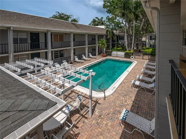 a view of a backyard with sitting area