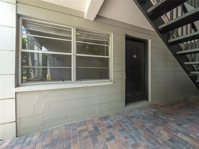 a view of empty room with a large window