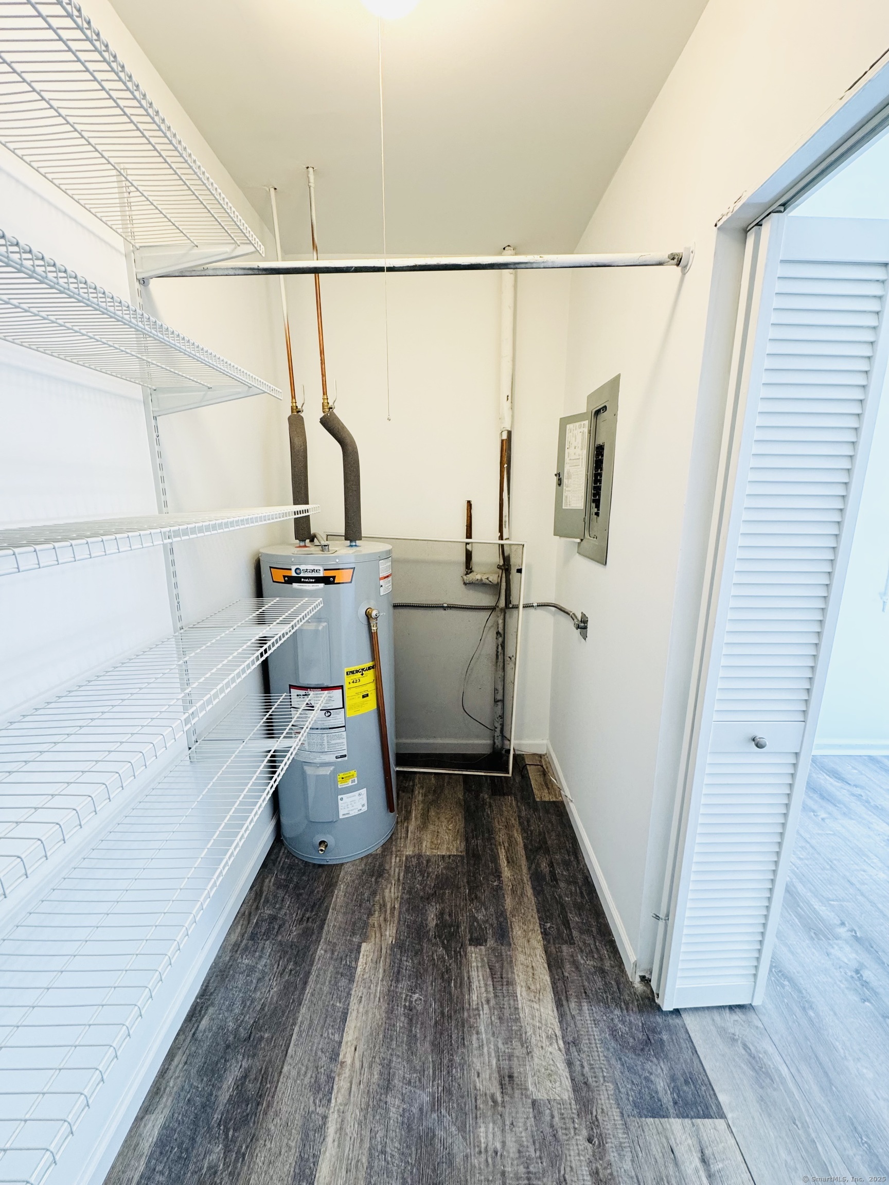 107 Niles Hill Road, Unit A New London, CT 06320 - Photo 17 of 22 a storage room with wooden floor