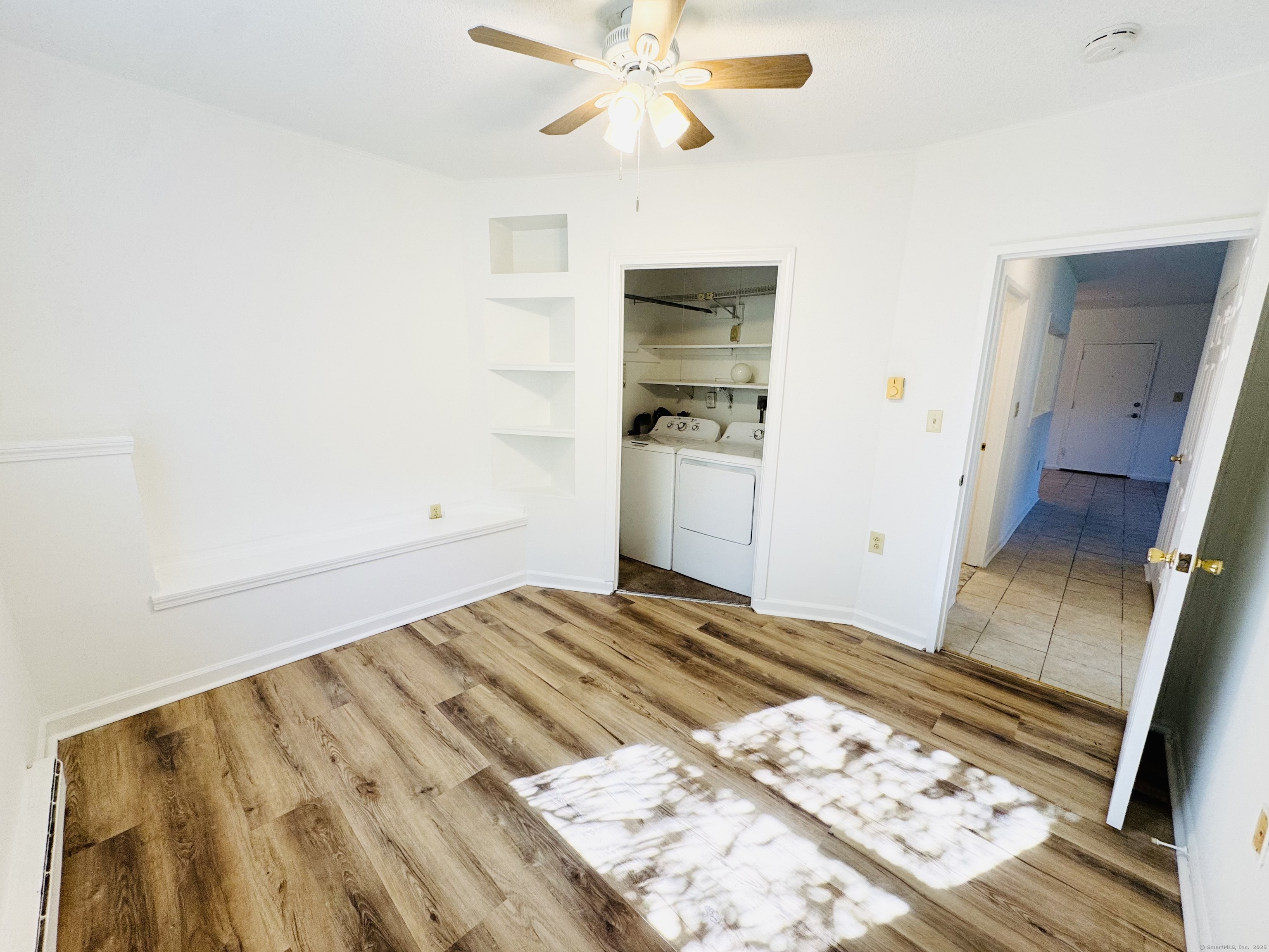 107 Niles Hill Road, Unit A New London, CT 06320 - Photo 19 of 22 a bedroom with a bed and a view of bathroom