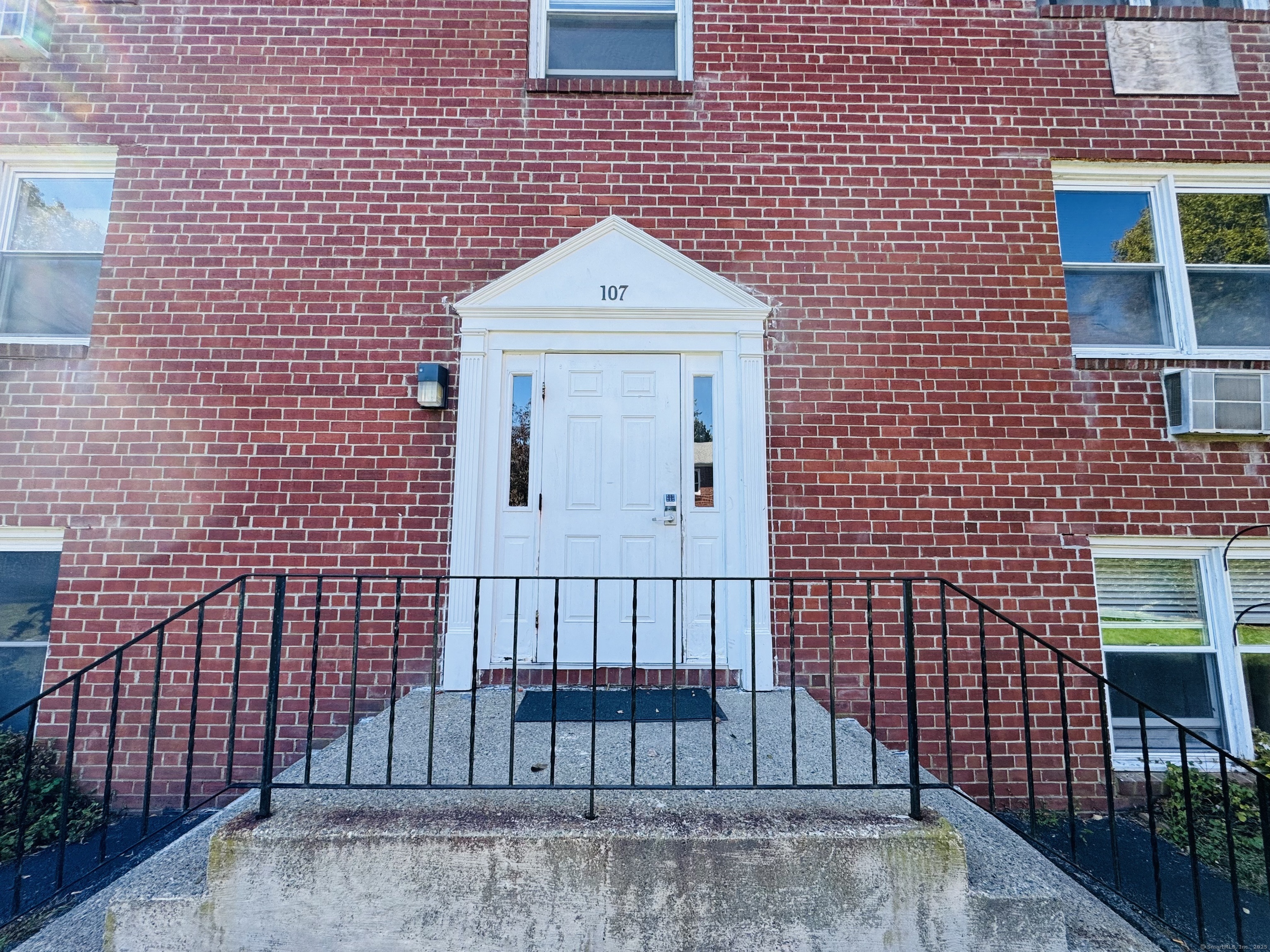 107 Niles Hill Road, Unit A New London, CT 06320 - Photo 2 of 22 a front view of a house with iron fence