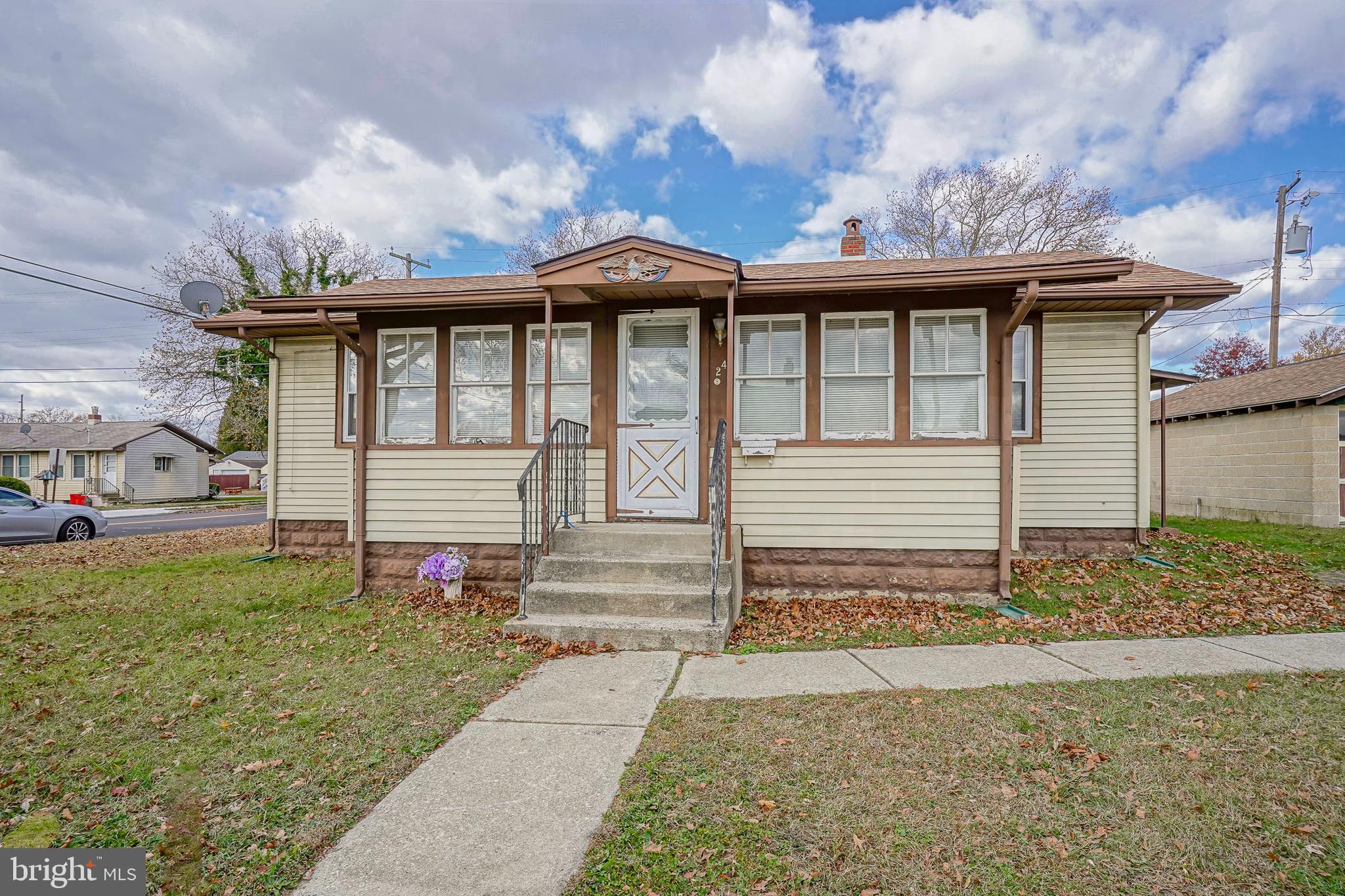 a front view of a house with a garden