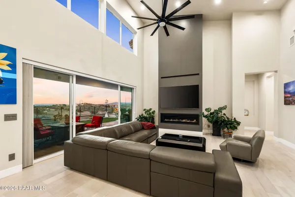 a open kitchen with stainless steel appliances granite countertop a sink dishwasher a stove and a refrigerator with wooden floor