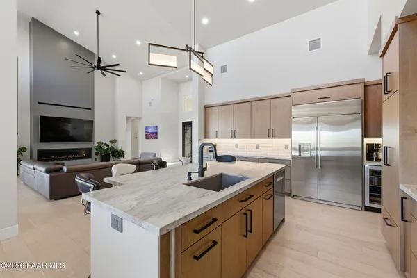 a bedroom with a bed and large flat screen tv