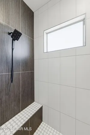 a living room with furniture and a walk in closet