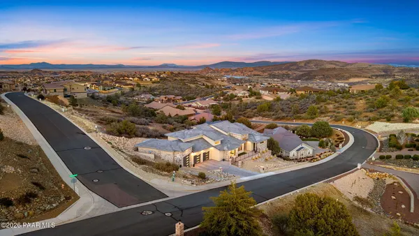 an aerial view of a house with a ocean view