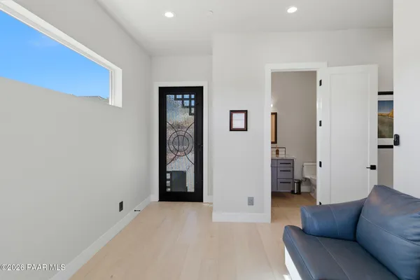 a view of workspace with a large window and couch
