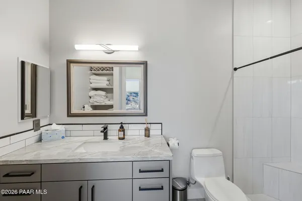 a room with furniture and air hockey table