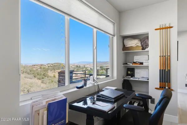 a view of a swimming pool with a terrace