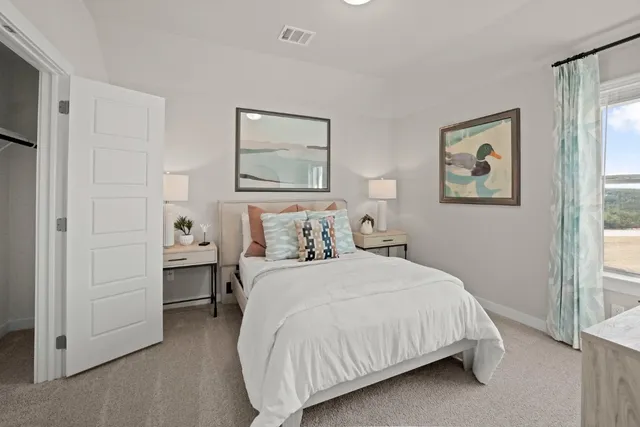 a bedroom with a bed and a view of bathroom