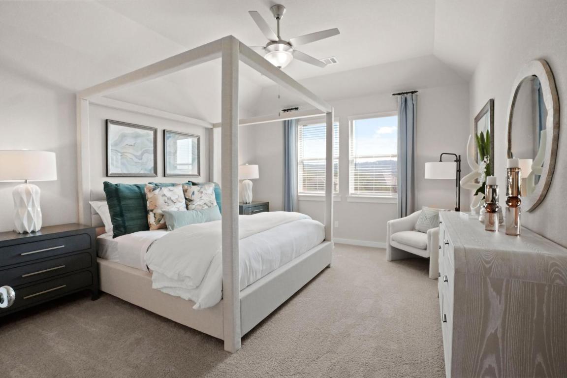 8112 Turning Leaf Circle Lago Vista, TX 78645 - Photo 2 of 29 a bedroom with a bed couch and window