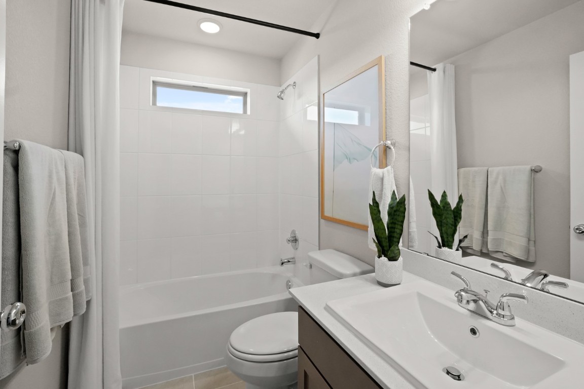 8112 Turning Leaf Circle Lago Vista, TX 78645 - Photo 21 of 29 a bathroom with a sink a toilet and shower