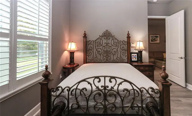 a living room with furniture ceiling fan and a window