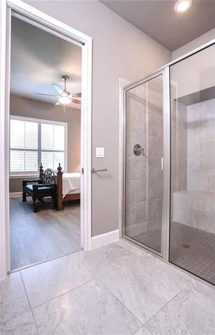 a bathroom with a glass shower door
