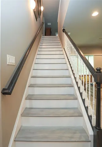 a view of room with white door and a closet