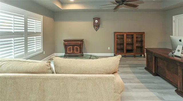 a spacious bedroom with a bed and a window