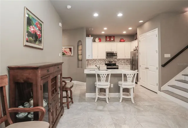 a view of a livingroom with furniture and a potted plant