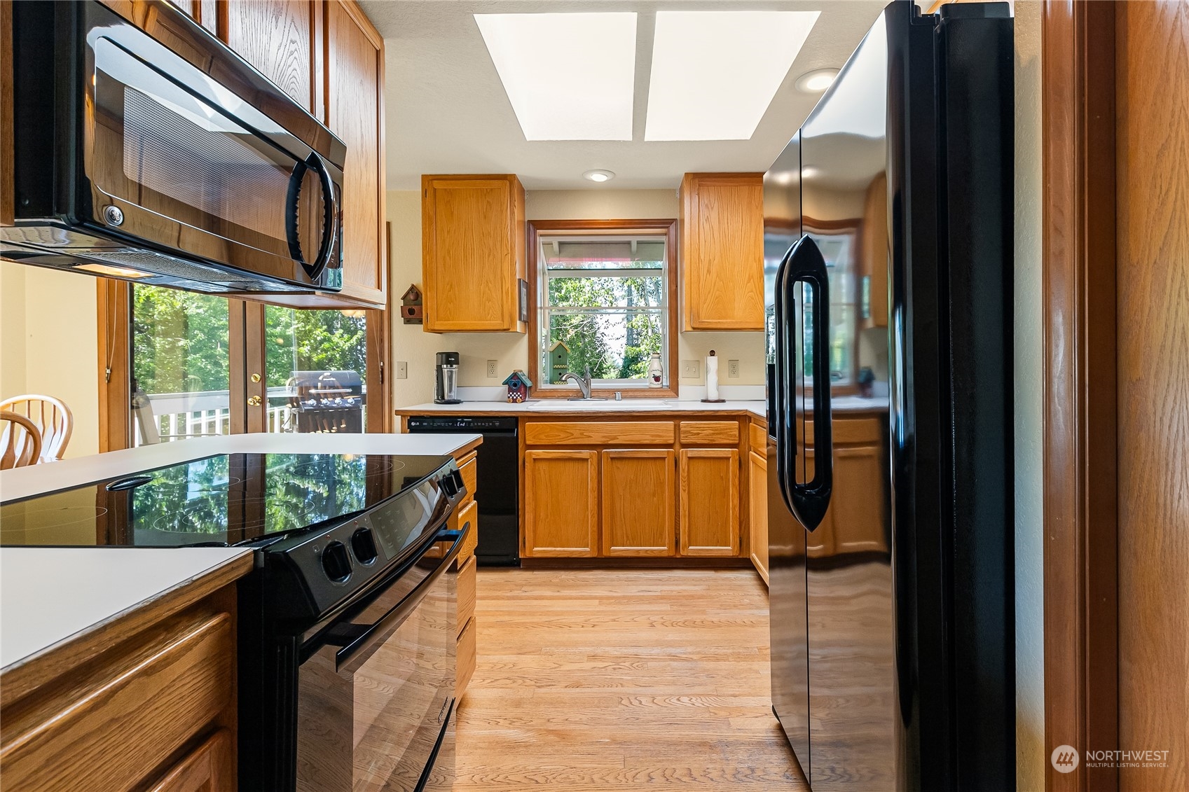 1388 Welling Road Bellingham, WA 98226 - Photo 11 of 40 a kitchen with stainless steel appliances granite countertop a stove a sink and a refrigerator