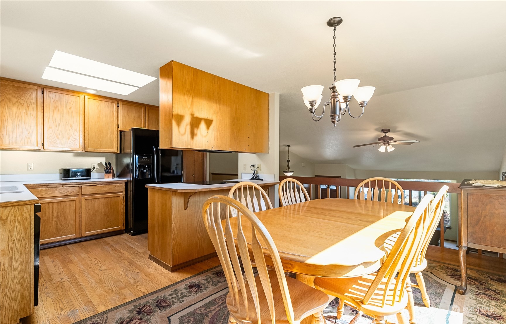 1388 Welling Road Bellingham, WA 98226 - Photo 16 of 40 a view of a kitchen and dining room with a chandelier