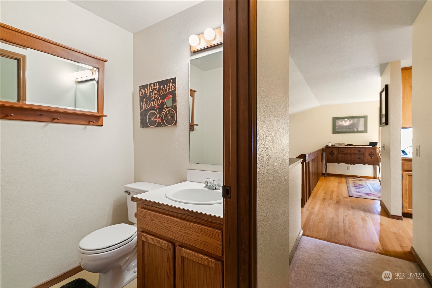 1388 Welling Road Bellingham, WA 98226 - Photo 17 of 40 a bathroom with a toilet sink and mirror