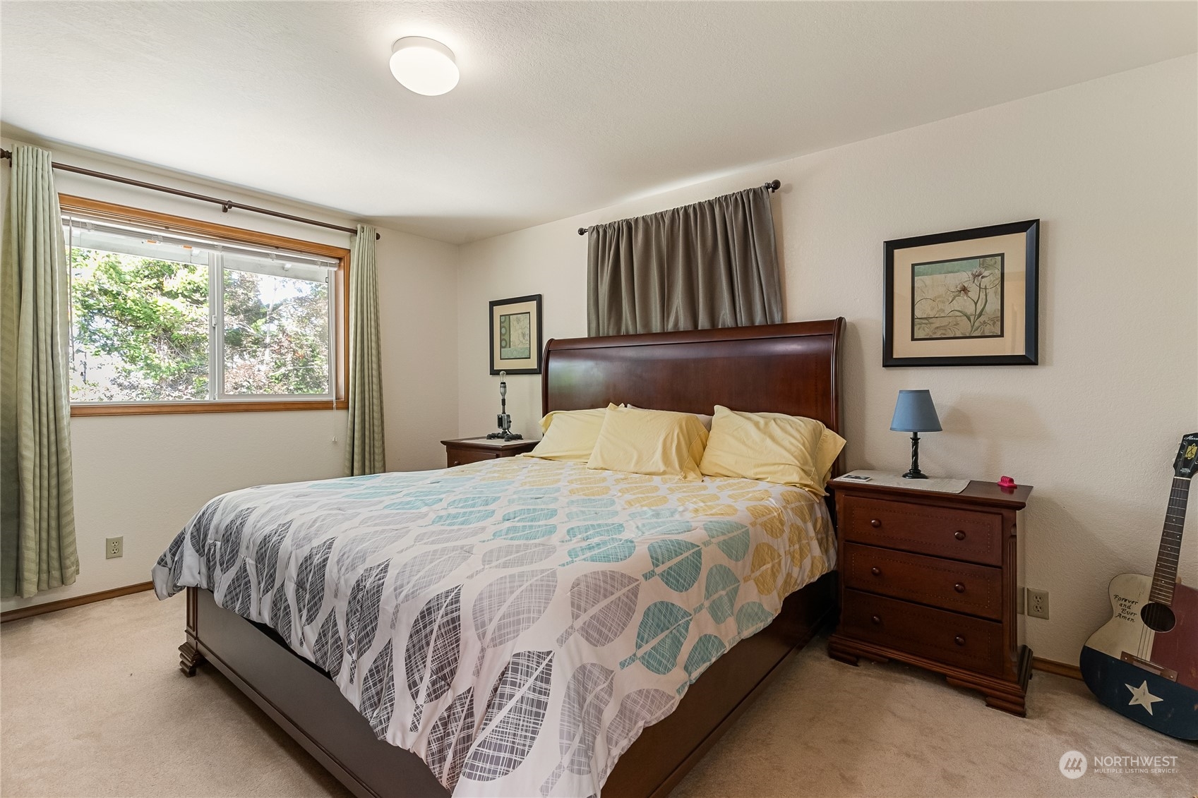 1388 Welling Road Bellingham, WA 98226 - Photo 20 of 40 a large bed sitting in a bedroom next to a window