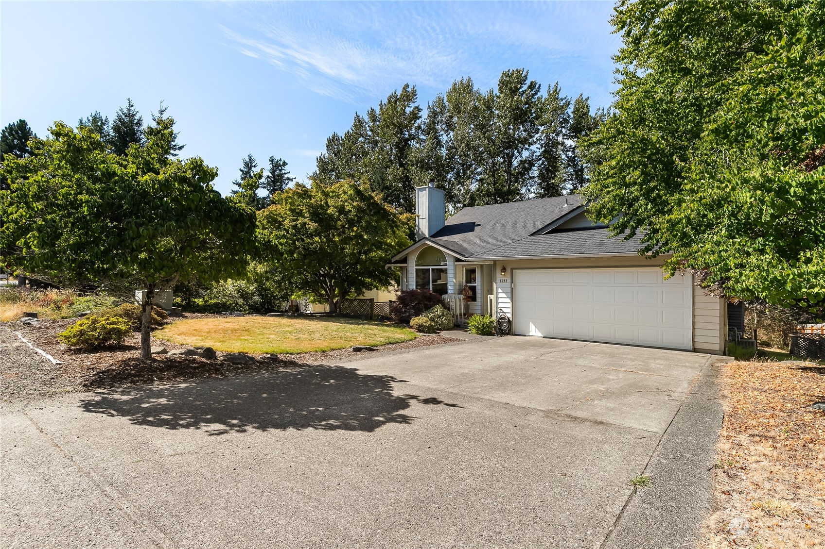 1388 Welling Road Bellingham, WA 98226 - Photo 2 of 40 a view of a house with a yard and large tree