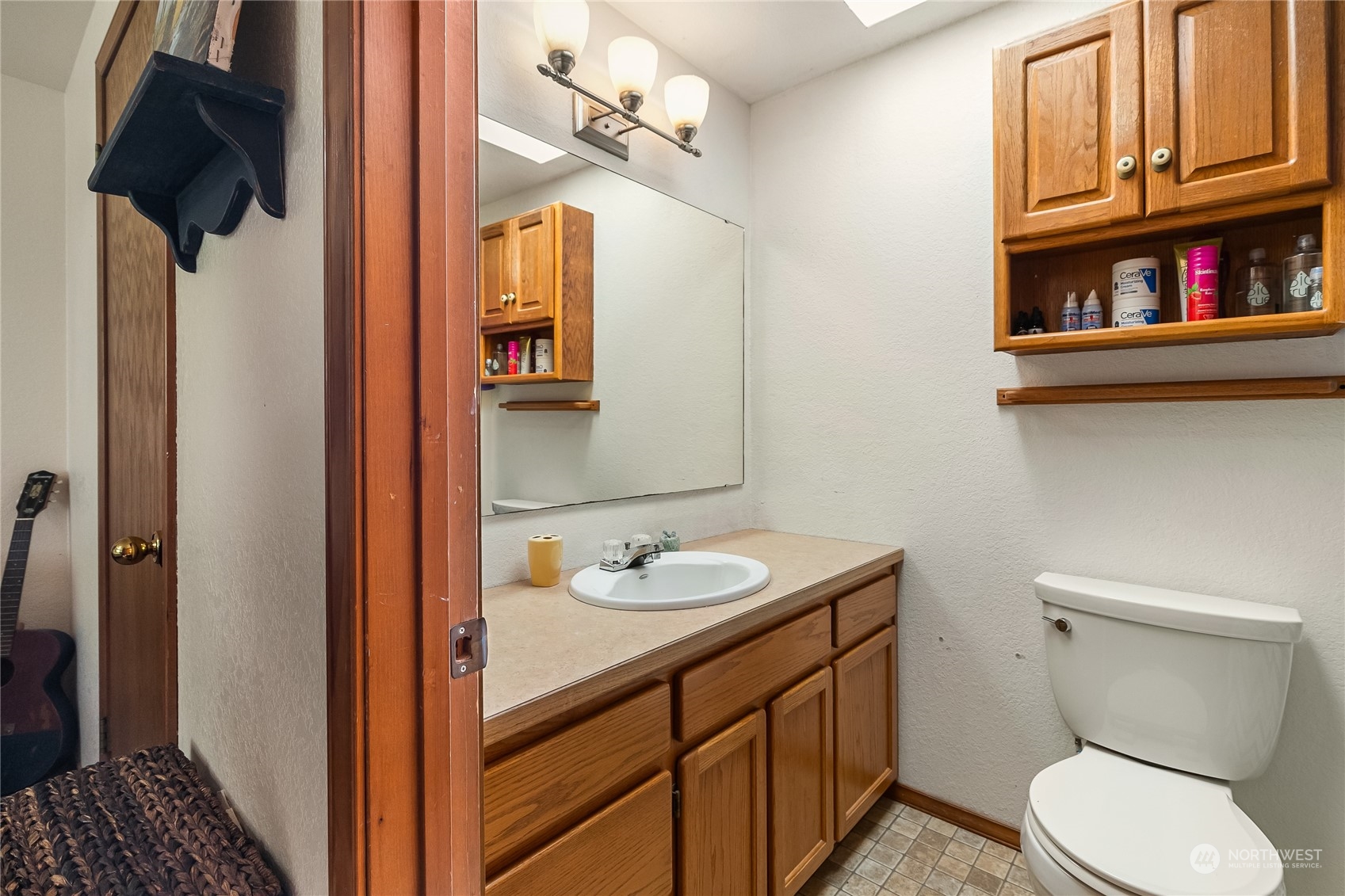 1388 Welling Road Bellingham, WA 98226 - Photo 22 of 40 a bathroom with a sink a toilet and a mirror