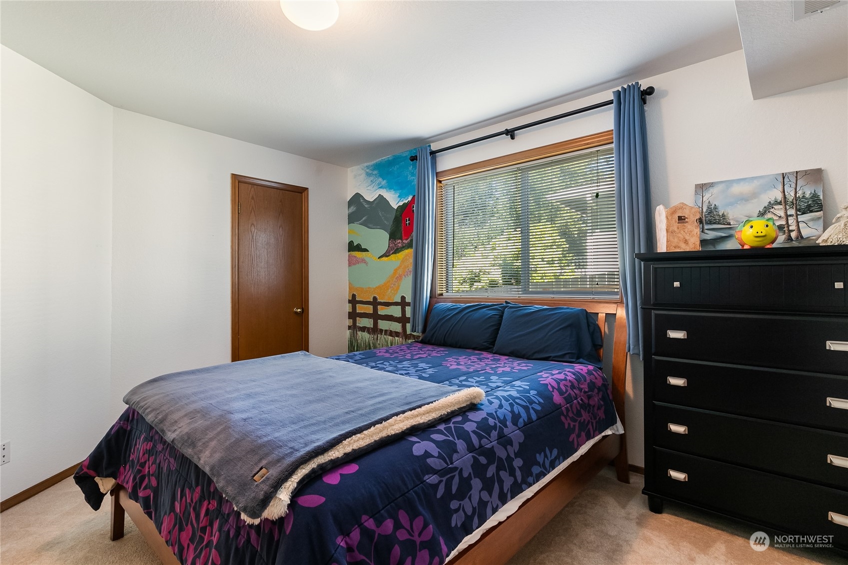 1388 Welling Road Bellingham, WA 98226 - Photo 26 of 40 a bedroom with a bed and a dresser next to a window