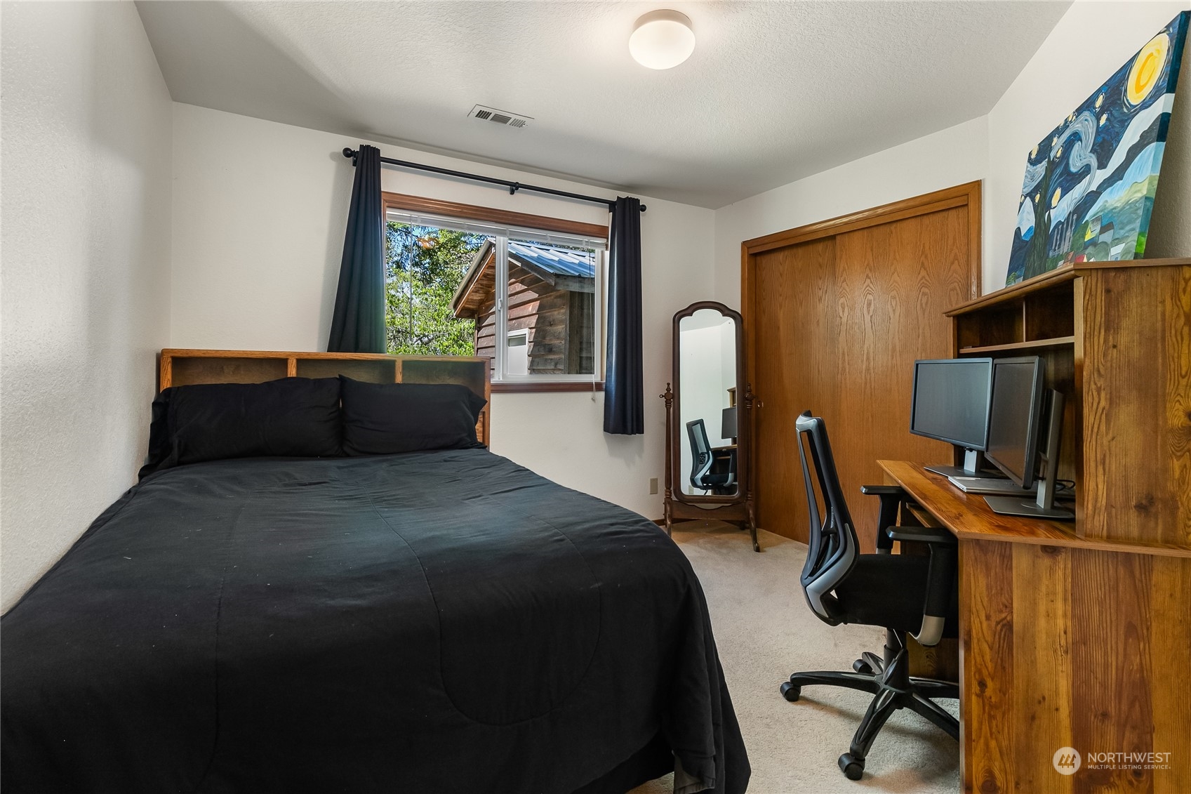 1388 Welling Road Bellingham, WA 98226 - Photo 29 of 40 a bedroom with a bed and a flat screen tv