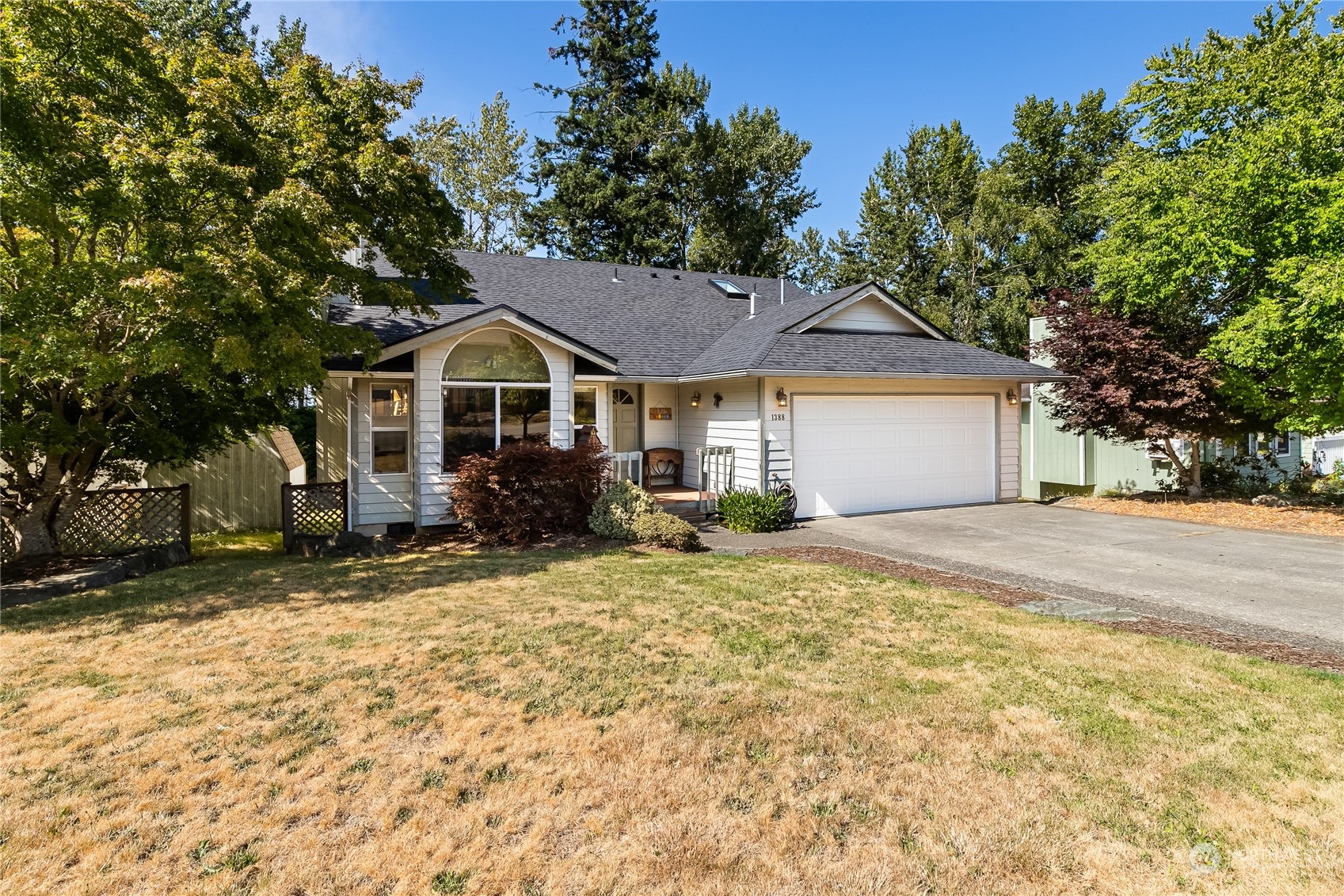 1388 Welling Road Bellingham, WA 98226 - Photo 3 of 40 a front view of a house with a yard