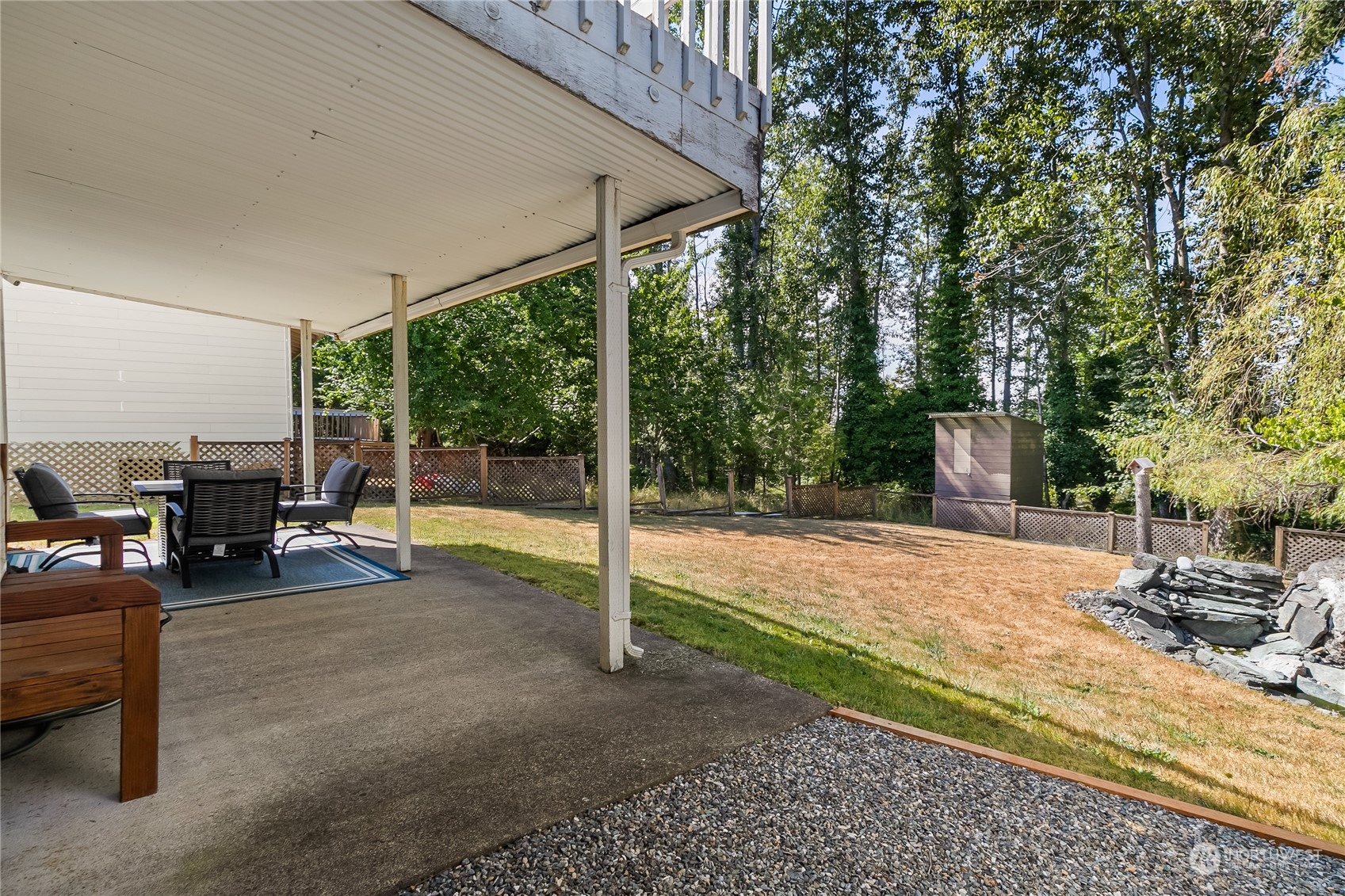 1388 Welling Road Bellingham, WA 98226 - Photo 36 of 40 a view of a house with backyard porch and sitting area