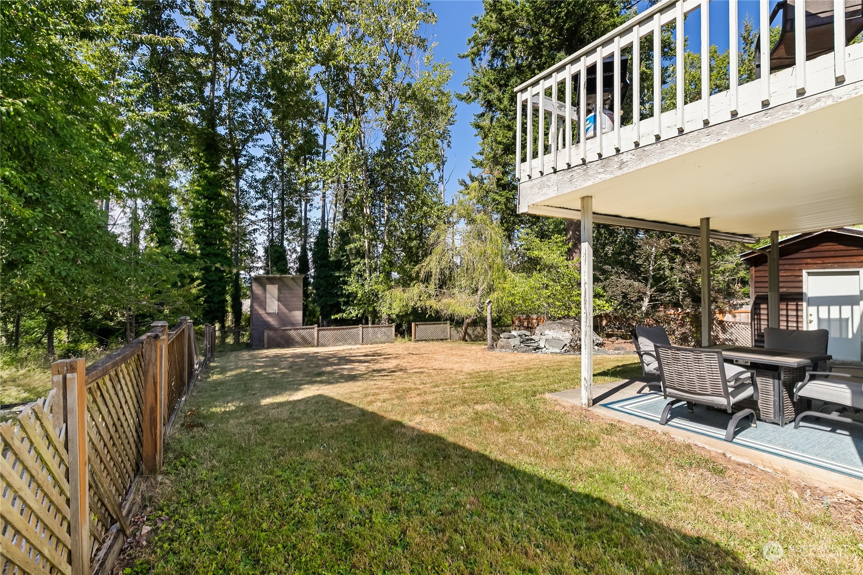 1388 Welling Road Bellingham, WA 98226 - Photo 37 of 40 a view of a house with backyard and sitting area