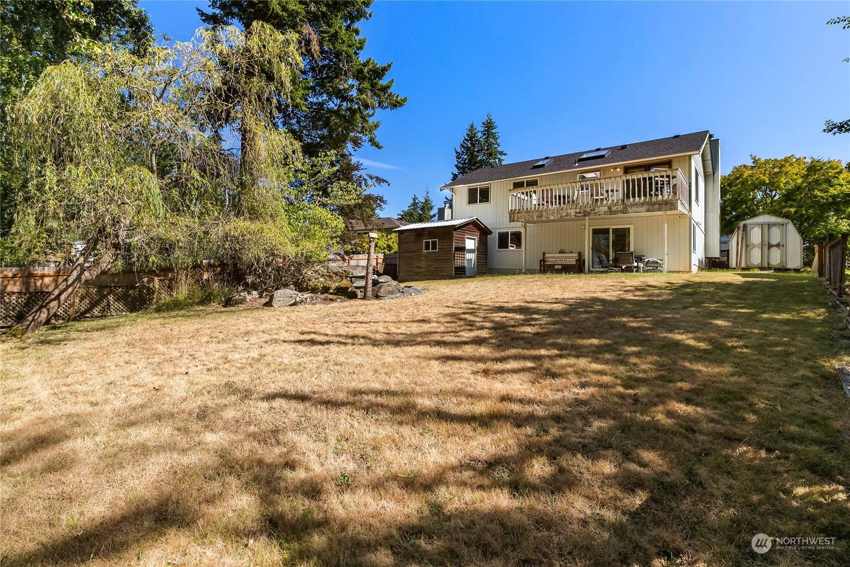 1388 Welling Road Bellingham, WA 98226 - Photo 38 of 40 a large building with a large tree in front of it