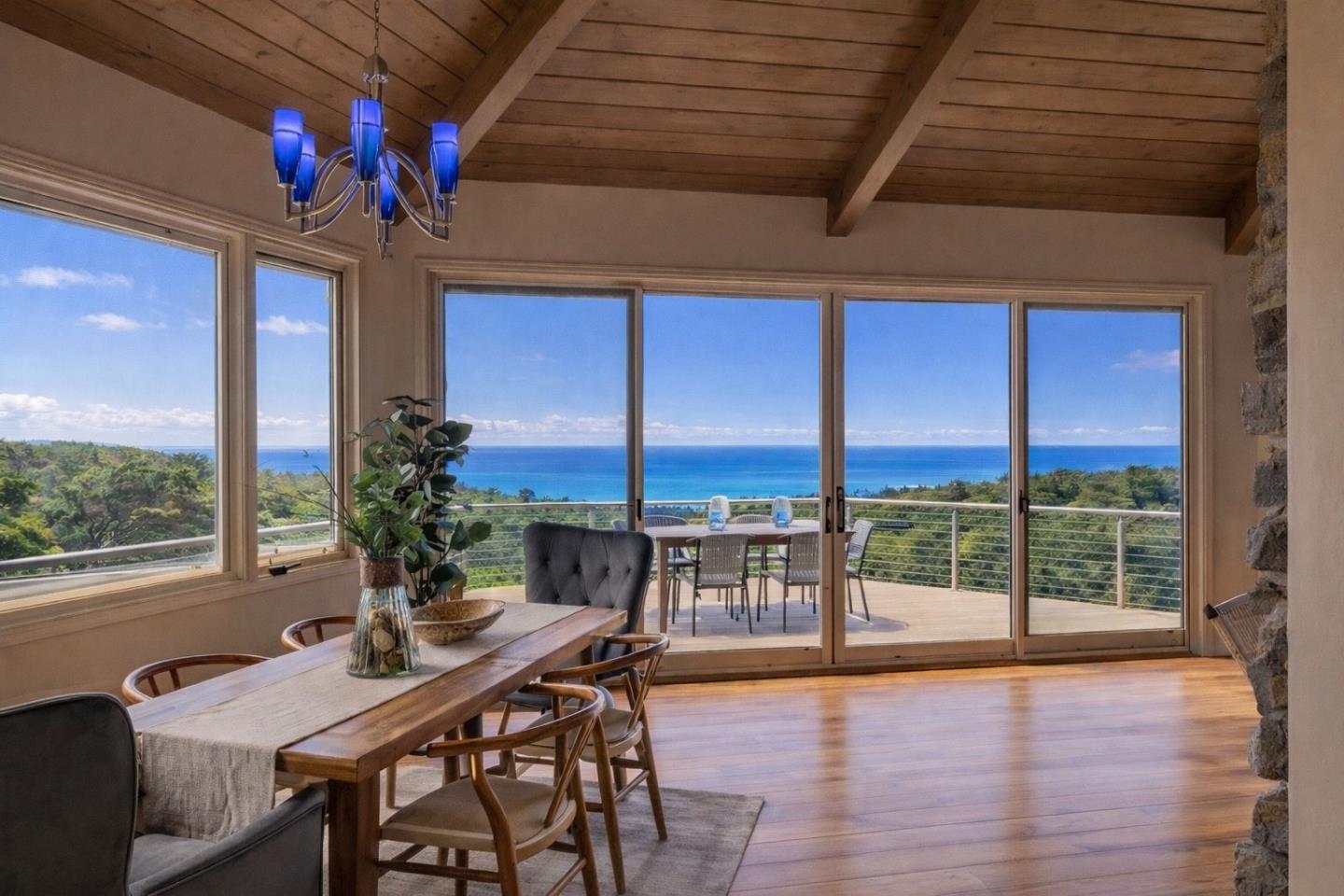 430 Quail Run Road Aptos, CA 95003 - Photo 2 of 34 a view of a dining room with furniture large windows and wooden floor