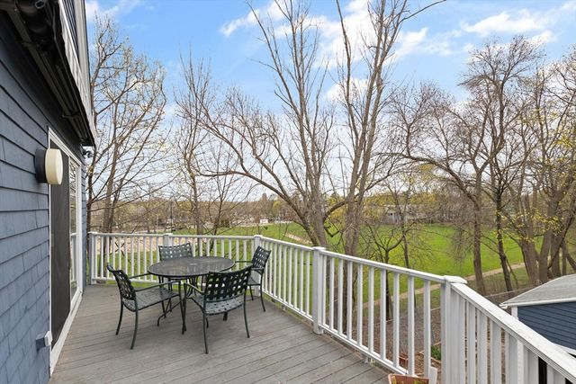 a view of a patio with iron fence