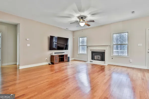 a kitchen with stainless steel appliances granite countertop a refrigerator stove microwave and sink